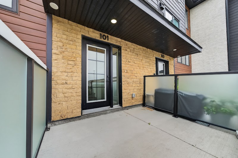 The private patio at the front door of unit 101