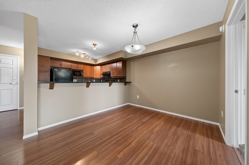 Living and dining, with the breakfast bar beyond