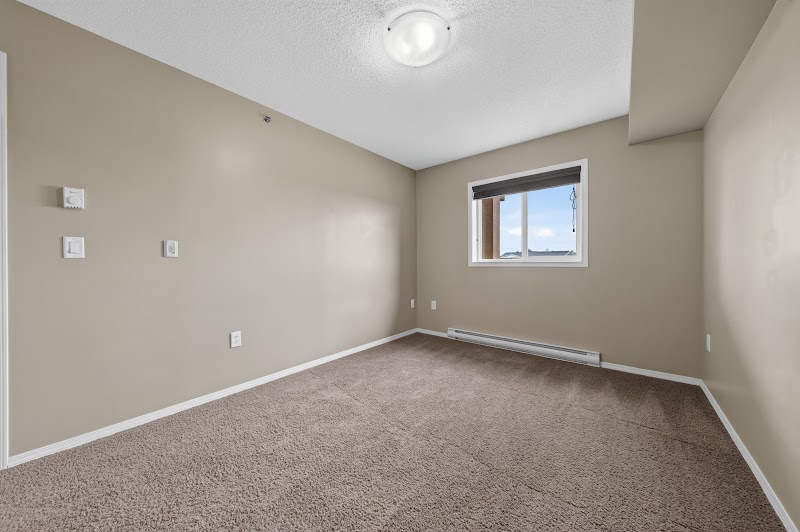 A carpeted bedroom