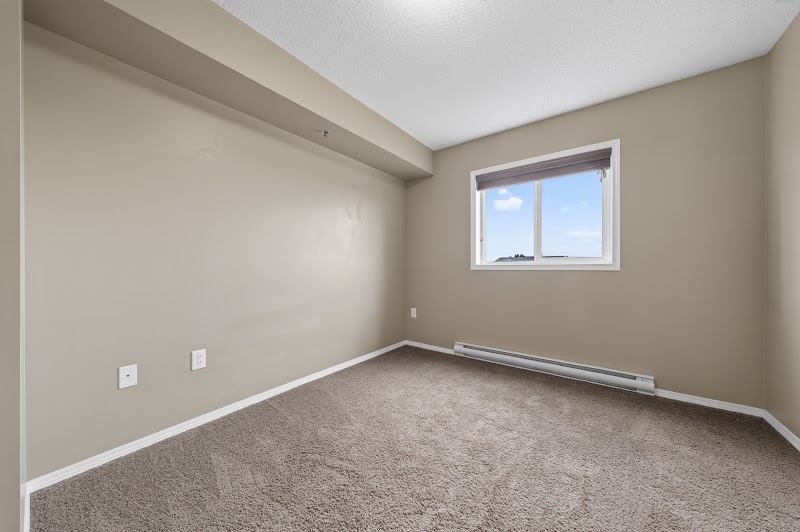 A carpeted bedroom