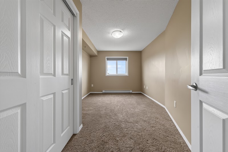 A carpeted bedroom